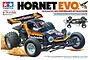 Tamiya Hornet EVO 1/10 scale RC buggy kit box art showing the black and orange off-road vehicle in action.