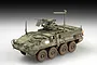 A fully assembled and painted 1/72 scale model of a US Army M1131 Stryker FSV armoured vehicle on a neutral background.