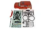 Element RC Trailrunner painted fire red body shell with decal sheet, plastic parts tree, and accessories on a white background.