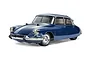 A studio shot of a 1/10 scale Tamiya Citroen DS RC car model in blue, featuring chrome bumpers and detailed wheels on a white background.