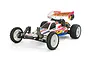 A studio shot of a Tamiya Super Astute 1/10 scale 2WD RC buggy with white wheels, off-road tires, and a white body with colourful decals.