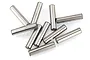 A collection of ten small, cylindrical metal drive pins scattered on a white background.