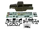 Element RC Enduro Ecto 1/10 scale green painted body shell with decal sheets and black plastic accessory parts on a white background.